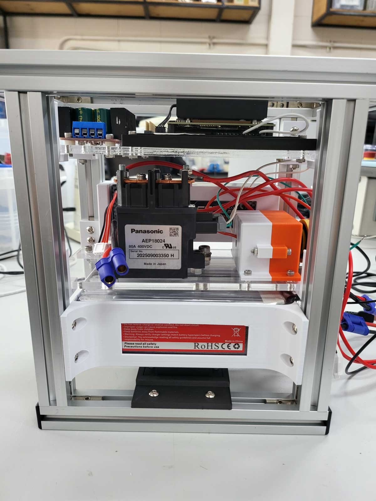 Front view of the body frame: the computer on the top floor, the power relay and other components on the middle floor, and the battery below.
